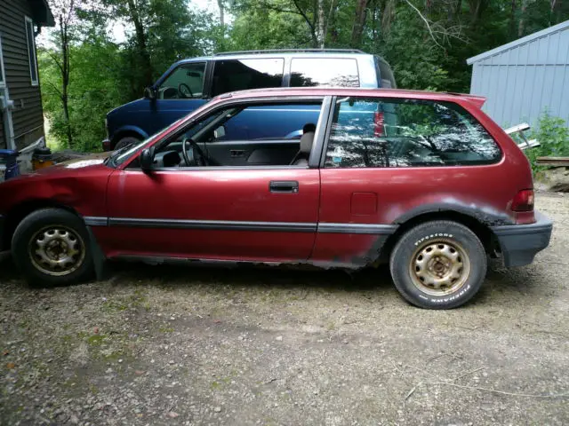 burgundy w/black interior - used/fair condition - 2 door hatchback - 32 mpg!!