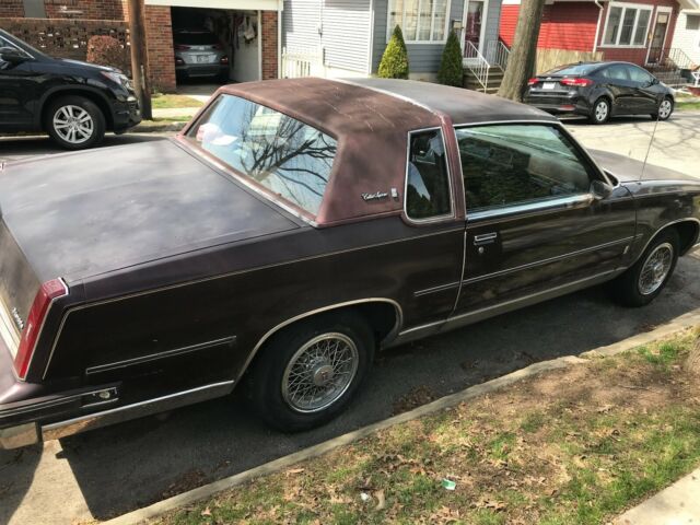 1987 oldsmobile 2 door maroon cutlass supreme