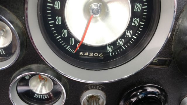 n.o.m. 327 v8, 4 speed, riverside red c2; same owner for 33 years