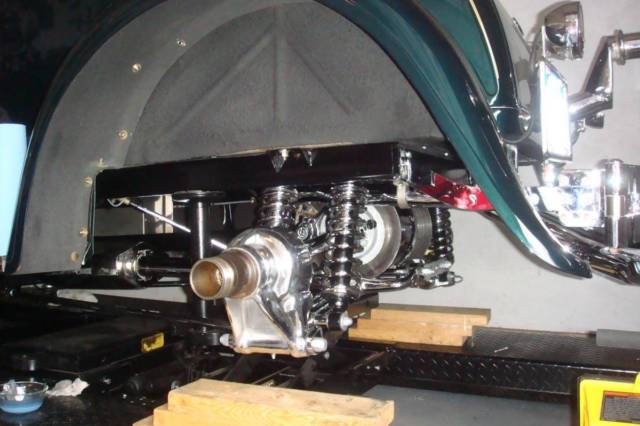1930 model a ford 5 window coupe on a chromed jaguar xke suspension. 305 chevy