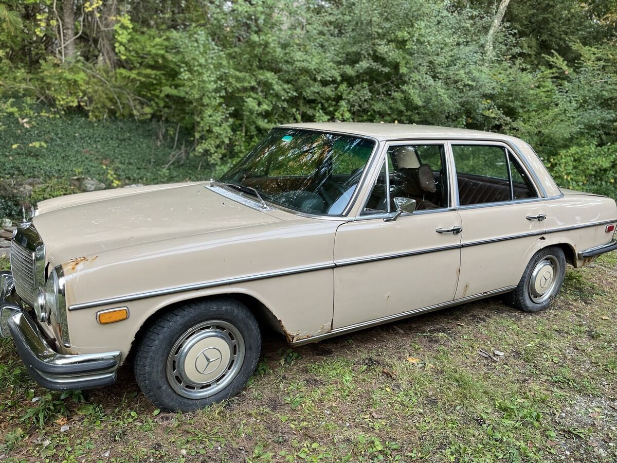 1973 mercedes-benz 200 sedan yellow brown leather seats
