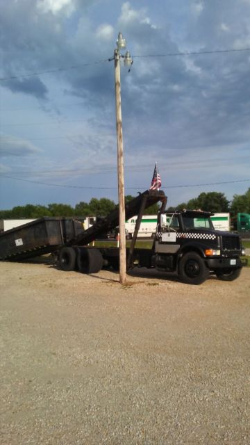 international roll off and 2 dumpsters