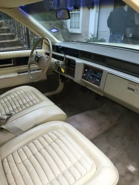 1985 triple-yellow cadillac deville
