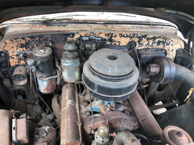 barn find, covered in blankets, parked over a carpet, solid floors, car intact