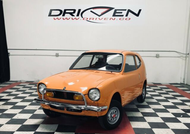 cool z600 coupe in pop orange. 50k miles restored collectible by driven.co