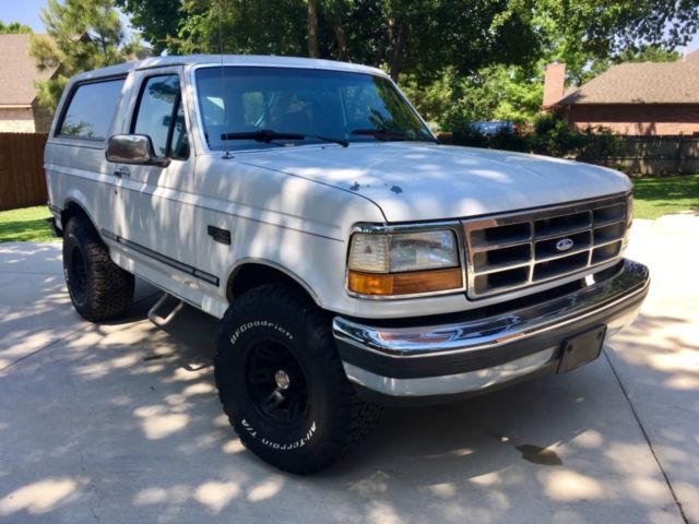 ‘92 ford bronco, 5.8 liter, 4x wheel drive, white w red interior, 4 new atv’s