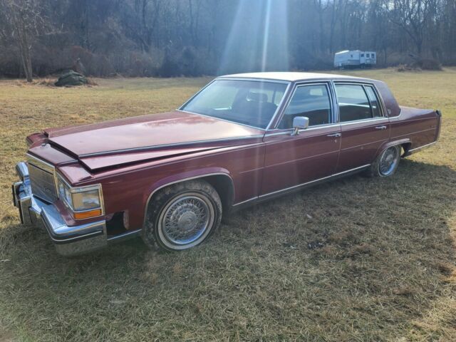 1985 cadillac fleetwood sedan red rwd automatic brougham