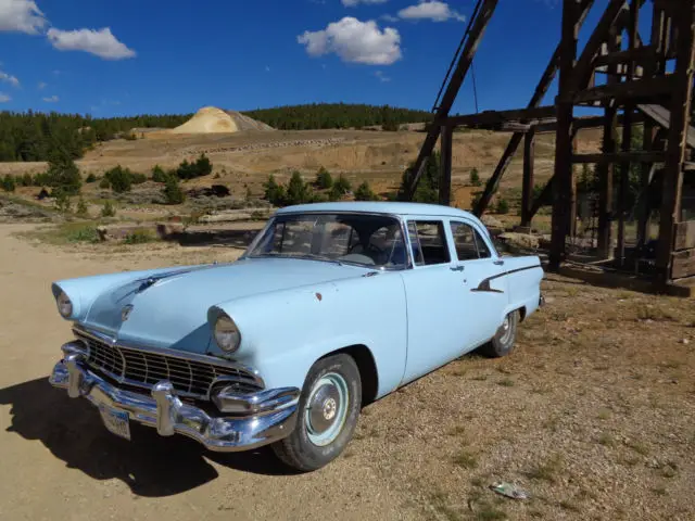 blue 1956 ford mainline 4 door sedan