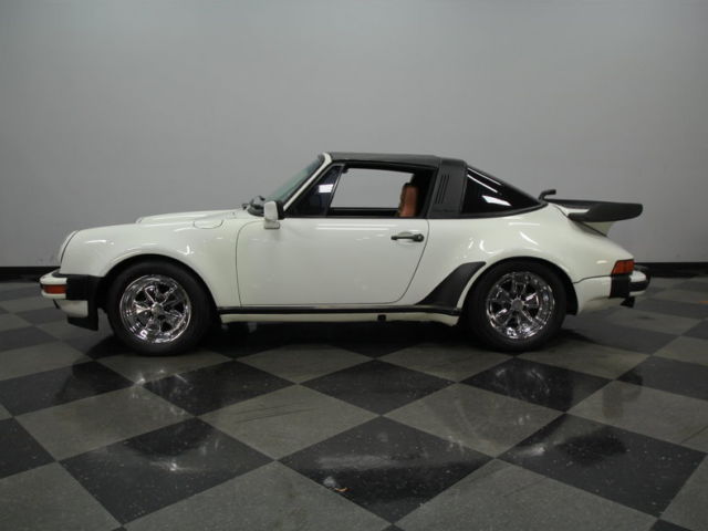 wide body, targa top, 3.2l 6 cyl, 4 whl discs, very nice interior, classic color