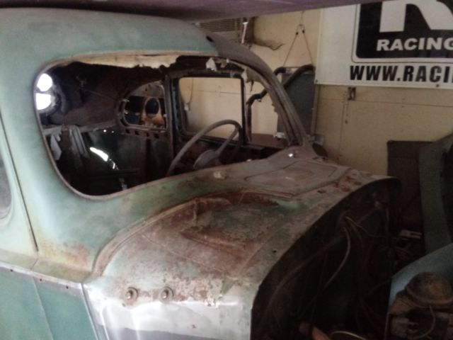 1940 packard 2 door, 5 passenger coupe. green in color, 6-cylinder engine