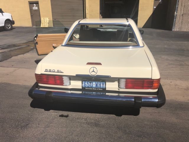 1988 560sl mercedes, cream outside, brown inside