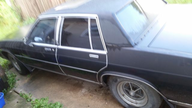 black 4 door sedan with sun roof. suitable for restoring. ask for photos