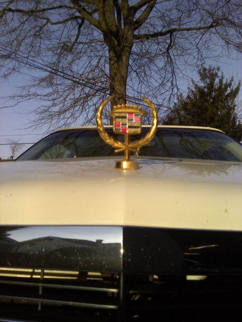 1991 white/white cadillac coupe deville....108,777 original miles