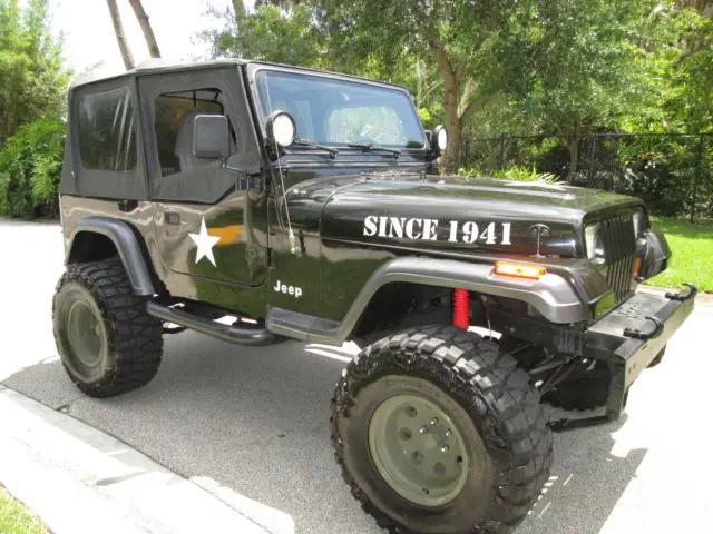 green,lifted,4wd jeep wrangler,5 speed