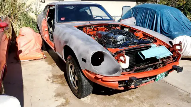 1977 datsun 280 zx orange rwd automatic black