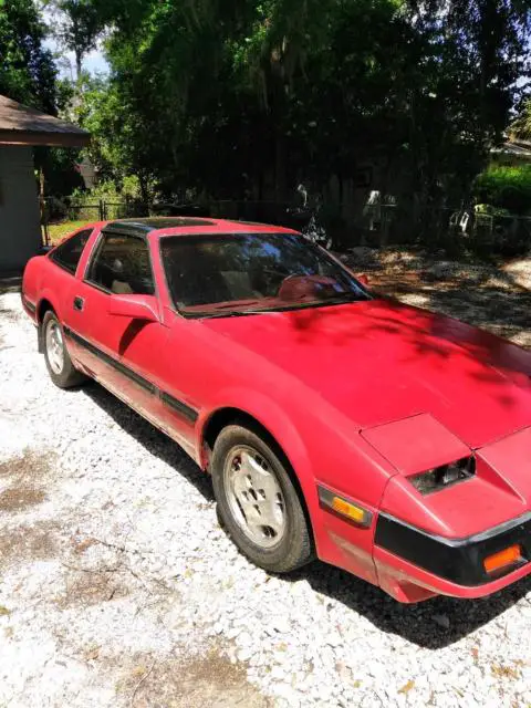 1985 nissian 300zx red outside and black inside with hatchback