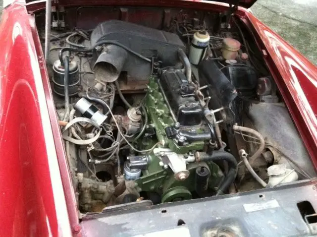this is a 1973 chrome bumper mg midget mark iii "project car"