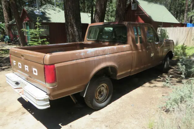 dual fuel tanks, extended cab, rear seats, tow package, heavy duty rear bumper