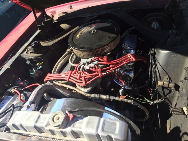 red convertible mustang with disc brakes
