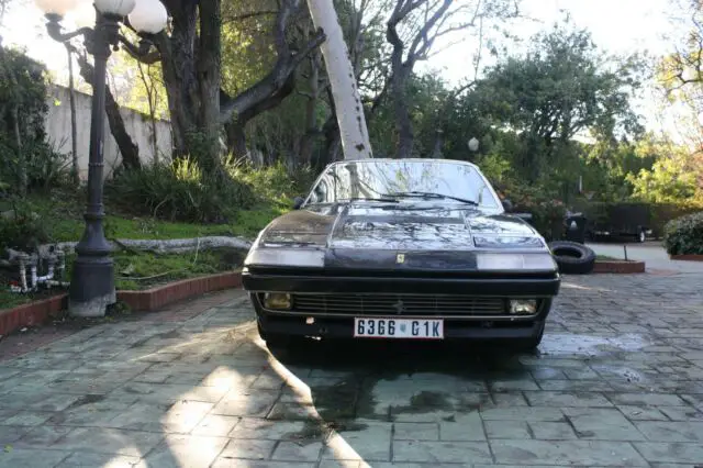 1986 ferrari 412 black with white interior