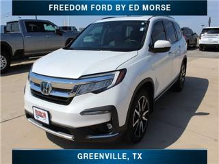 2021 Honda Pilot touring w/rear captain's chairs