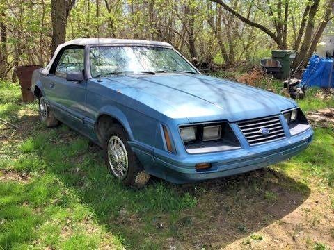 '83 blue 2 door ford mustang convertible