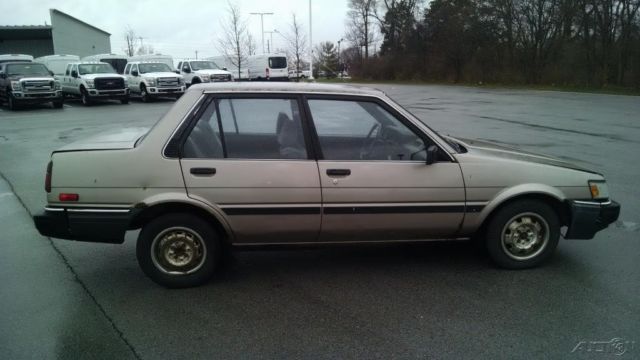 used 87 toyota corolla le 1.6l i4 cheap gold brown cloth radio hitch no reserve