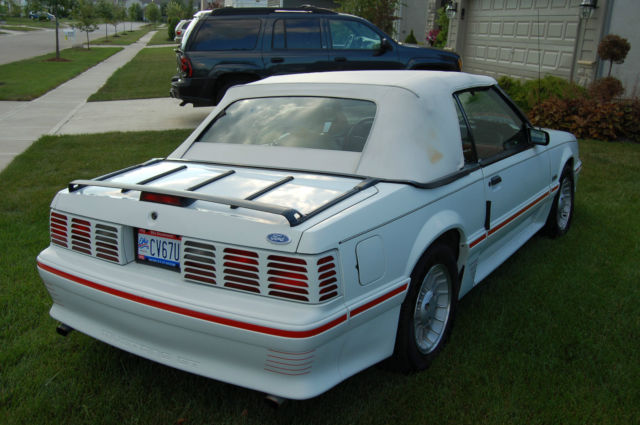 white exterior, top, leather interior, automatic, all stock, low mileage