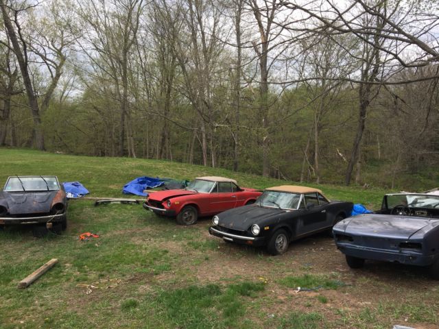 5 fiat 124 spiders and barn stall full of used parts