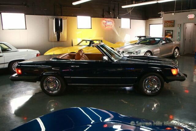 beautiful condition, midnight blue/tan, low miles, priced to sell