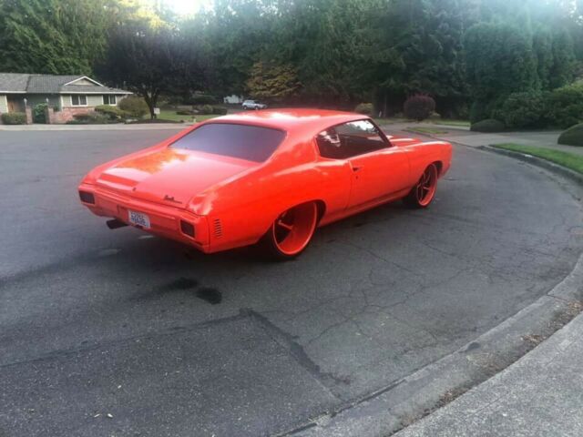 1970 chevelle custom on 24x15 wheels, hugger orange, big block chevy