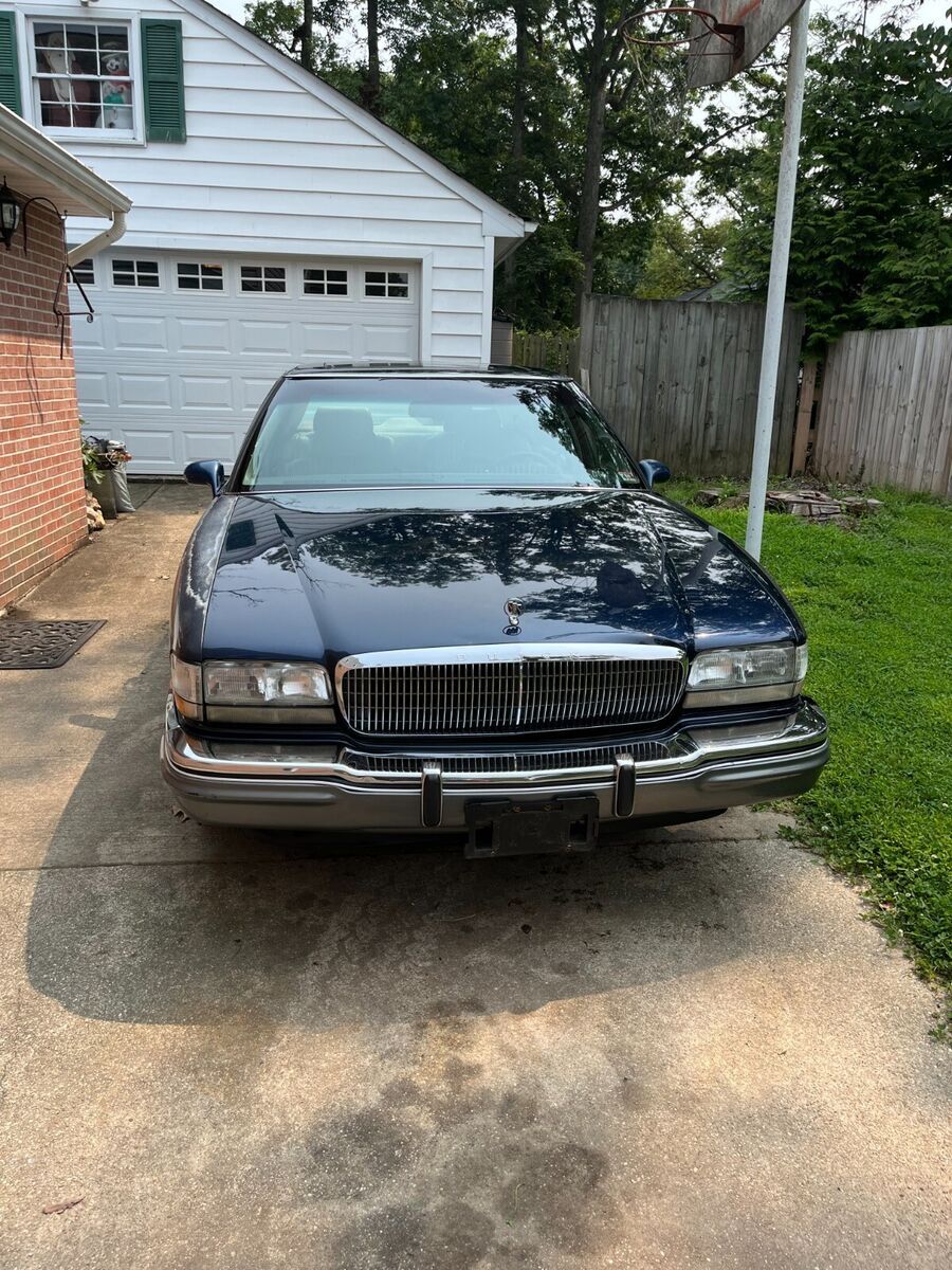 navy blue 4 door sedan with super charger