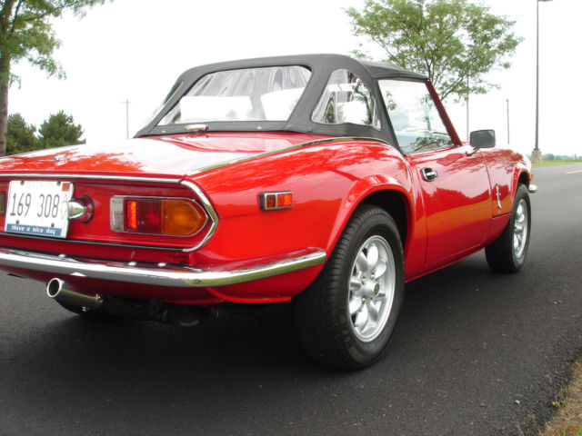beautiful restored 1978 triumph spitfire - red with black top