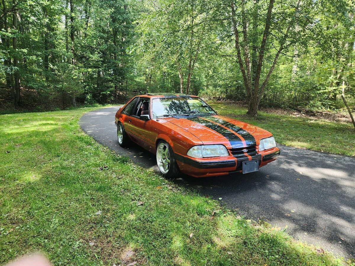 1986 ford mustang sedan orange rwd manual lx