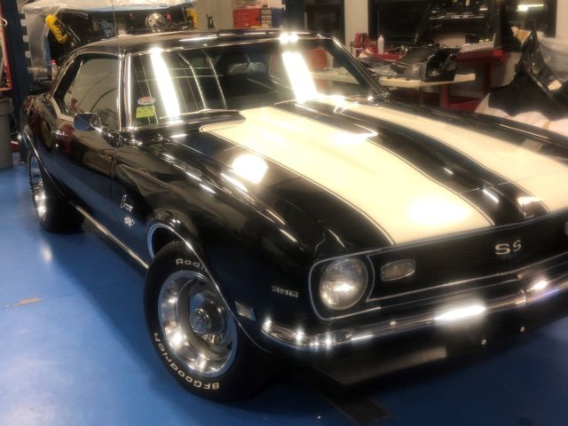 1968 camaro ss 396, texas car black, white stripes with ralley wheels
