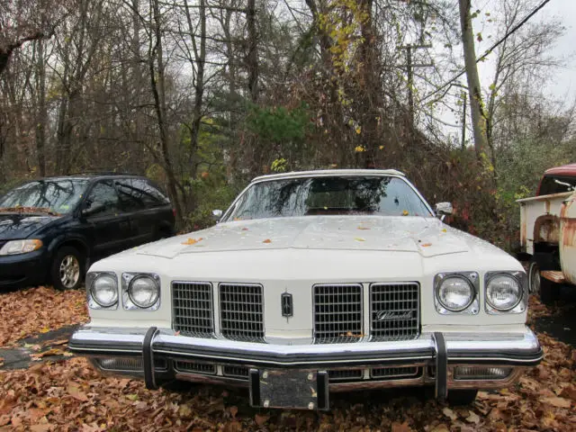oldsmobile delta 88 convertible 1975 white red interior 47k miles! very nice car