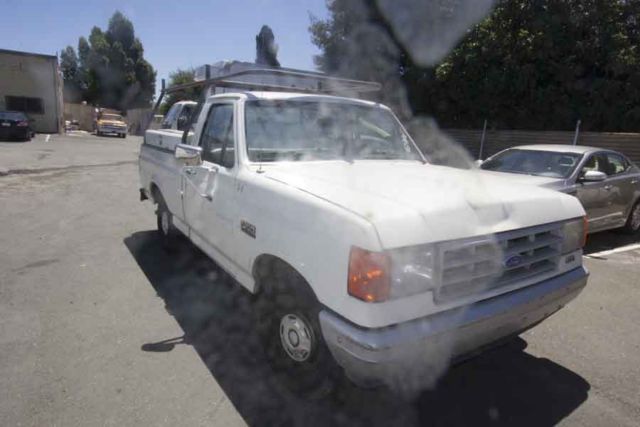 ford f150 with lumber rack, bed boxes, ac ---183k miles--started right up