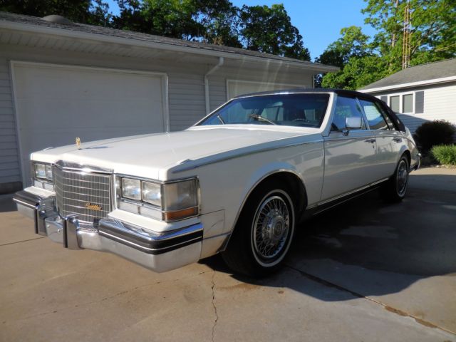1985 cadillac seville white and blue commemorative edition sedan 4-door 4.1l