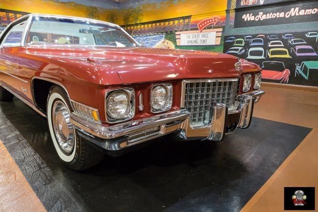 burgundy metallic cadillac deville with 13,242 miles available now!
