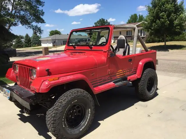1990 red 4wd jeep wrangler with hard and bikini top, new oversized tires