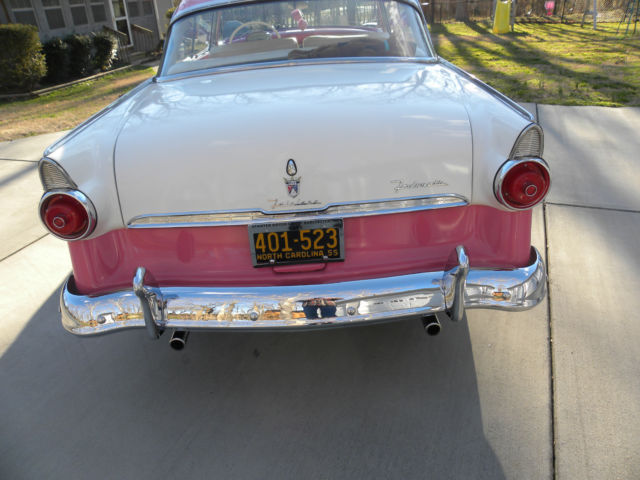 1955 pink and white ford fairlane victoria