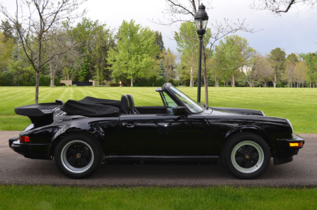 triple black with factory sport seats - passionately cared for - highly coveted!