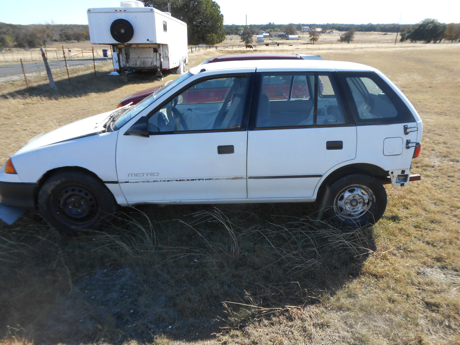 92 white 4 door geo metro 3 cylinder automatic transmission 50 mpg
