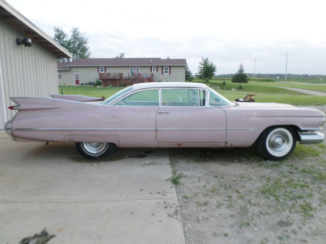 1959 pink cadillac two door hared top