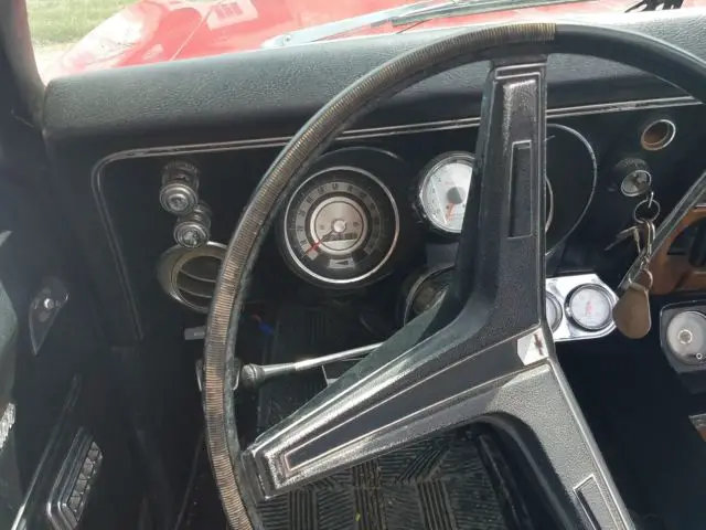 1968 red chevrolet camaro convertible with black top
