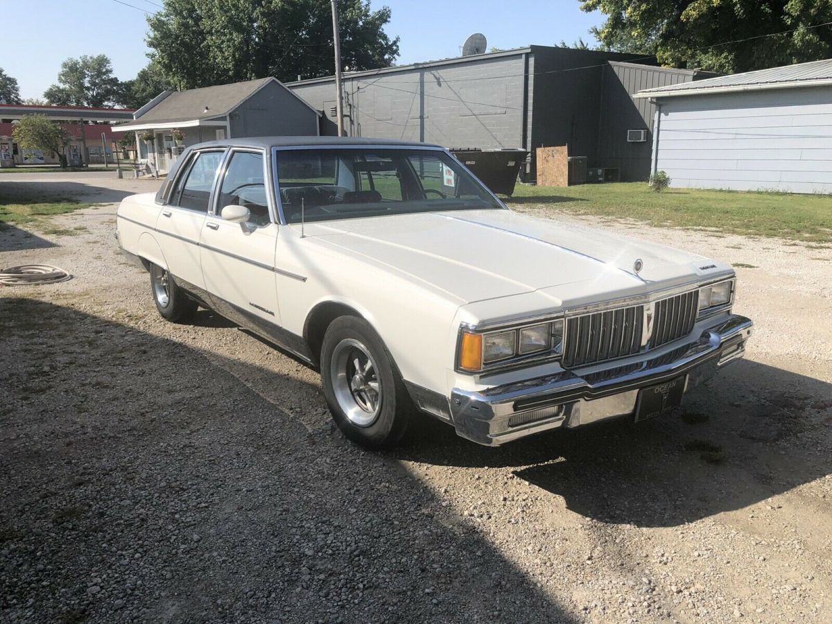 1986 pontiac parisienne sedan white rwd automatic brougham
