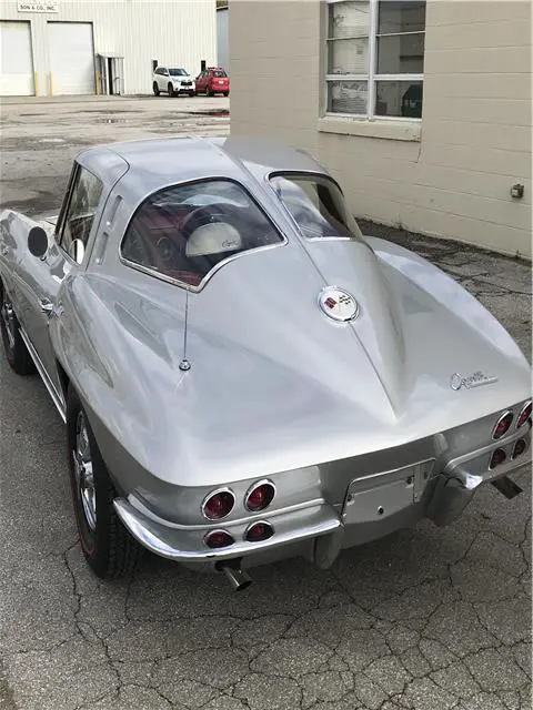 restored numbers matching 327 300hp silver with red interior split window coupe