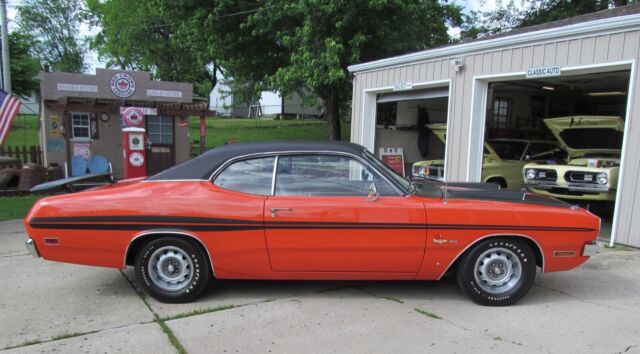 this is a restored 1971 dodge demon from grand spaulding dodge in chicago .this