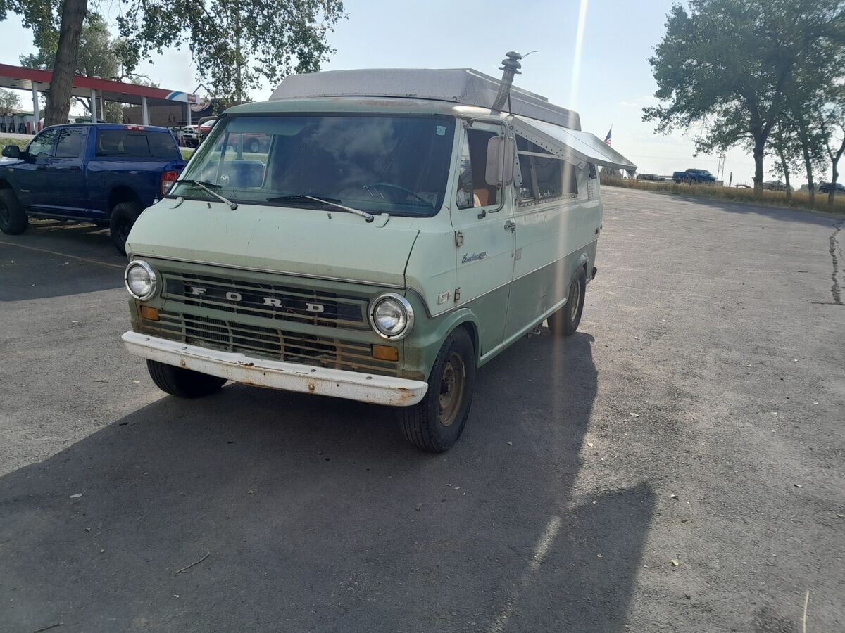 vintage econoline pop-up camper. live off the grid