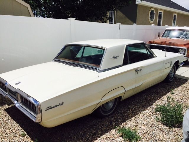 1965 tbird 6.4l 2 door white exterior, red interior, 35,000 miles, it runs!